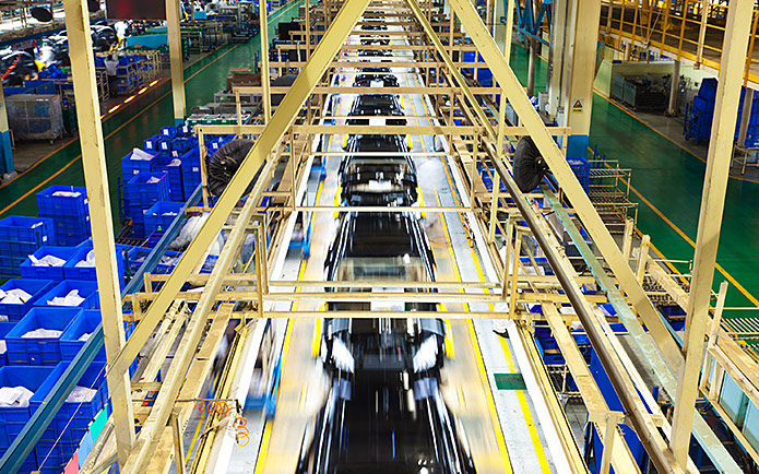 Cars being manufactured in a factory
