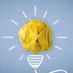 New Idea. Crumpled Paper Ball Glowing Bulb Concept.