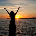 A picture of a woman on the beach.