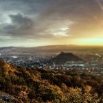 image of a village and sun